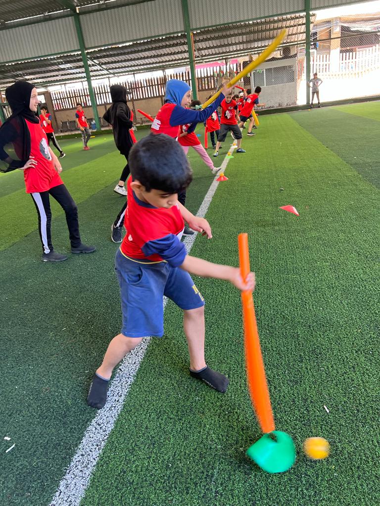 Baby playing cricket-charity cricket